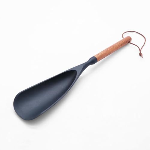 Black silicone cooking spoon with a wooden handle on a white background