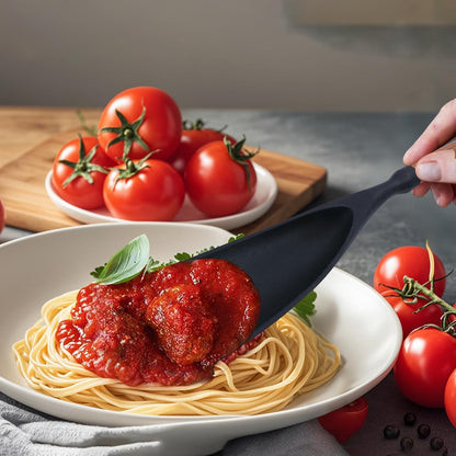 Black silicone cooking spoon serving pasta sauce